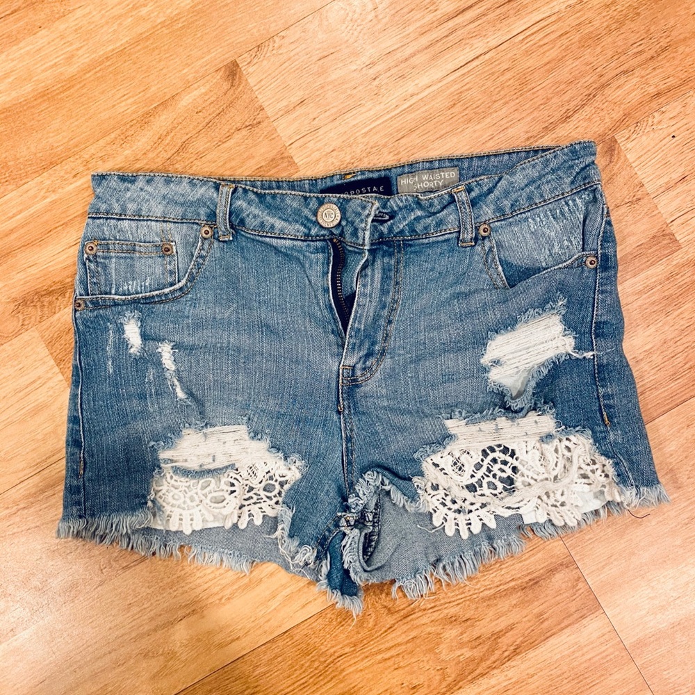 Denim shorts with lace trim pockets
